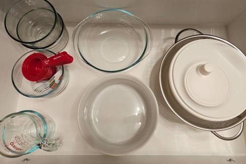 a group of plates and glasses on a table at The WEM House in Edmonton