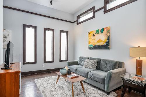 a living room with a couch and a table at Cozy Capitol Hill Cottage in Seattle