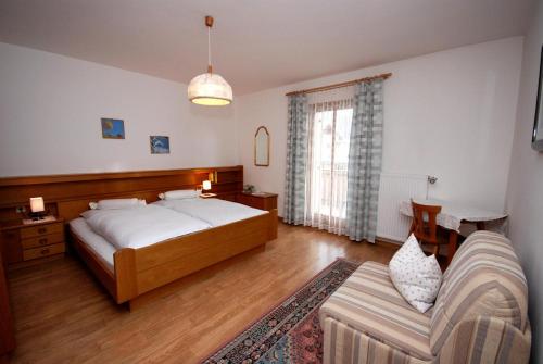 Ένα ή περισσότερα κρεβάτια σε δωμάτιο στο Appartments Oberhofer