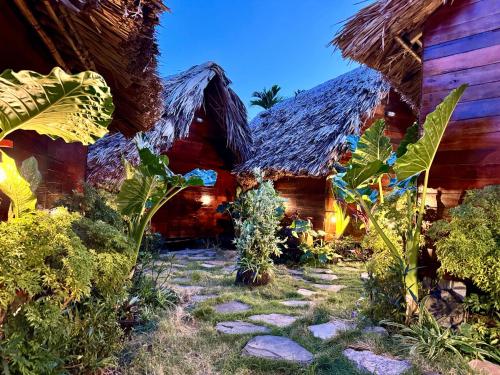 a group of houses with a pathway in front of them at JoyStay in Cat Ba