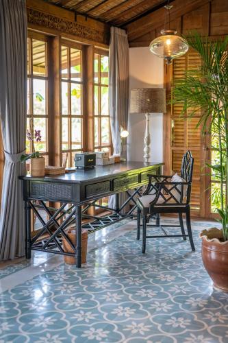 an office with a desk and a chair at Umah Lusa in Munduk