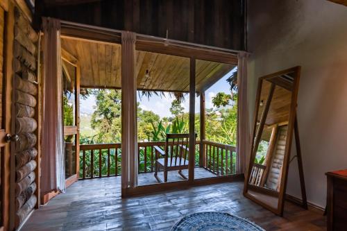 a view from the living room of a house with sliding glass doors at Toce House Tả van in Sa Pa