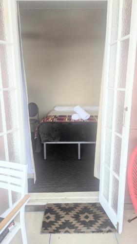 a bedroom with a bed in a room at GRAND CENTRAL HOTEL PROSERPINE in Proserpine