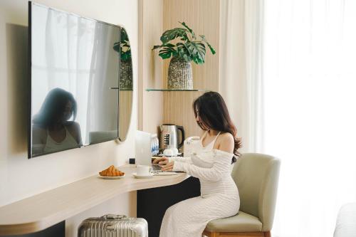 Телевизор и/или развлекательный центр в Elite Hotel Nha Trang