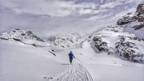 a person is skiing down a snow covered mountain at Holiday Inn West Yellowstone by IHG in West Yellowstone
