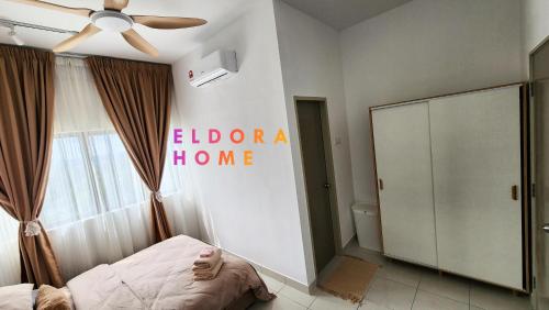 a bedroom with a bed and a ceiling fan at Rumah No 3 Youth City Residence Nilai in Nilai