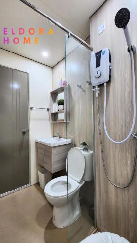 a bathroom with a shower with a toilet and a sink at Rumah No 3 Youth City Residence Nilai in Nilai