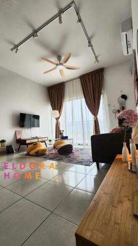 a living room with a ceiling fan and a couch at Rumah No 3 Youth City Residence Nilai in Nilai