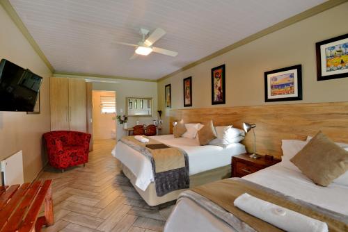 Voodi või voodid majutusasutuse Sunrock Guesthouse toas
