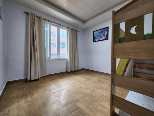 a room with a bunk bed and a window at Daemyeongyeok - house of gallery in Daegu