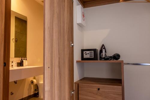 a bathroom with a sink and a mirror at KingSize Suite in Reforma Jacuzzi & Awesome Mexico City View in Mexico City