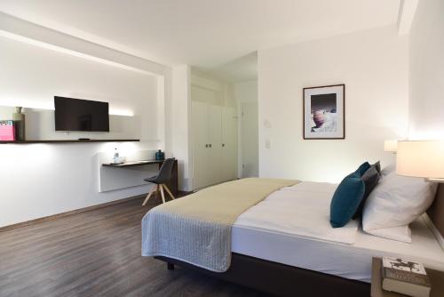 Postel nebo postele na pokoji v ubytování Guesthouse Lichtenau