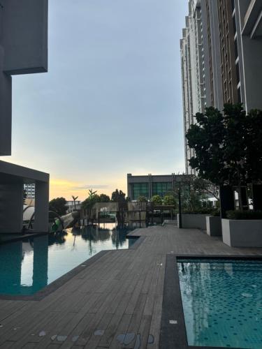 a swimming pool in the middle of a building at Skytrees Comfort Room With Simple Design Concept in Johor Bahru