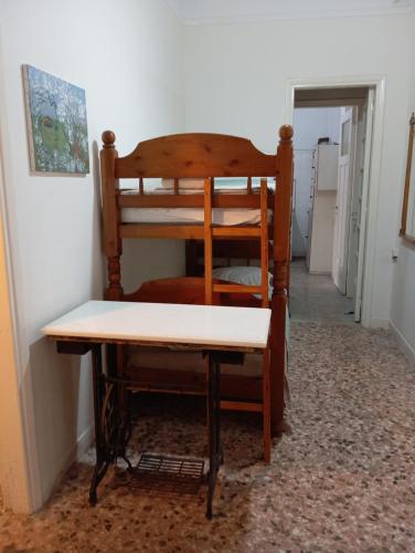 Wooden bunk bed in a dorm 5' from metro