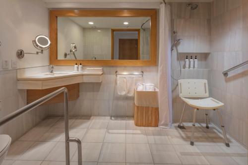 a bathroom with a sink and a mirror at Presidente InterContinental Puebla by IHG in Puebla