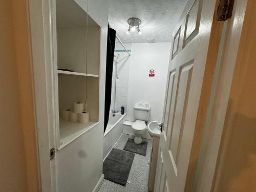 a small bathroom with a toilet and a sink at Double bed BW4 Accrington Burnley in Accrington