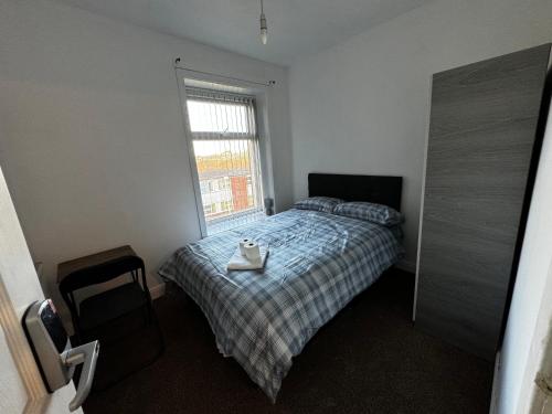 a bedroom with a bed with a tray on it at Double bed BW4 Accrington Burnley in Accrington