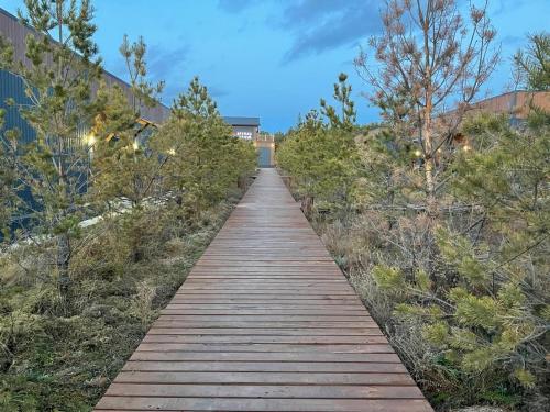 a wooden pathway leading up to a building at Atyrau Avenue in Vorobʼyëvka
