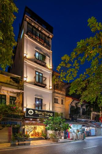a hotel with a sign on the side of a building at TrangTrang Luxury Hotel in Hanoi