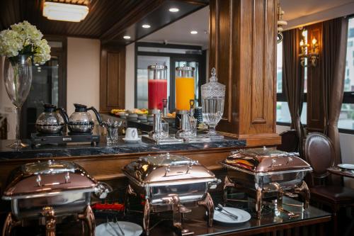 a counter with two drums in front of a mirror at TrangTrang Luxury Hotel in Hanoi