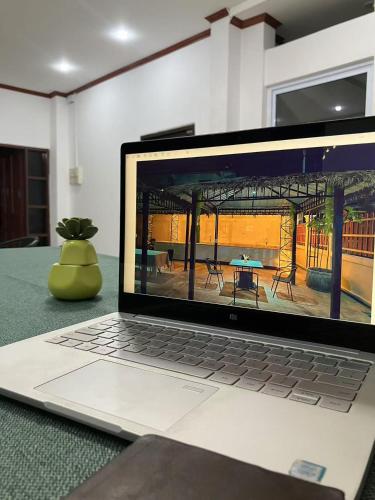 a laptop computer sitting on top of a table at Venn Hostel in Vientiane