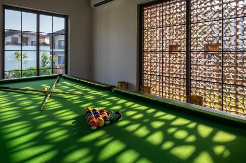 a room with a pool table with balls on it at Evoke Dholavira in Dholovira