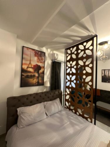 a bedroom with a bed with a wooden gate at Blue Sky in Skopje