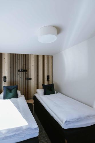 Łóżko lub łóżka w pokoju w obiekcie House 55