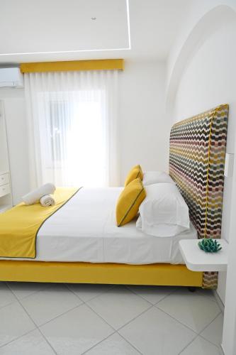 Ένα ή περισσότερα κρεβάτια σε δωμάτιο στο Gala Residence Villa Giovanna