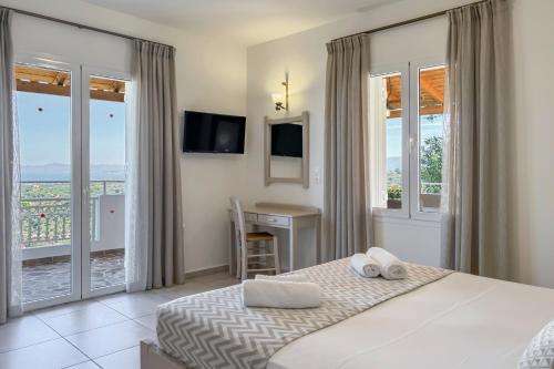 Postel nebo postele na pokoji v ubytování Pano Stalos Villas
