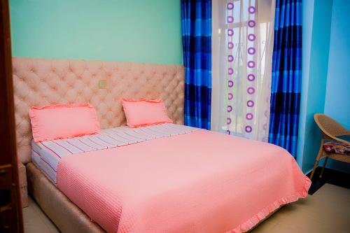 Una cama o camas en una habitación de Umugano Villa