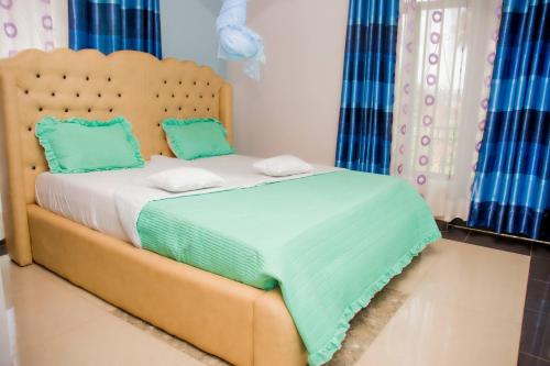 Una cama o camas en una habitación de Umugano Villa