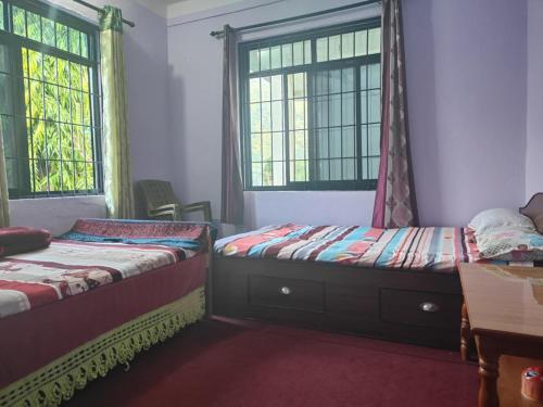 Ένα ή περισσότερα κρεβάτια σε δωμάτιο στο Manthali Community Homestay No13 Aakase