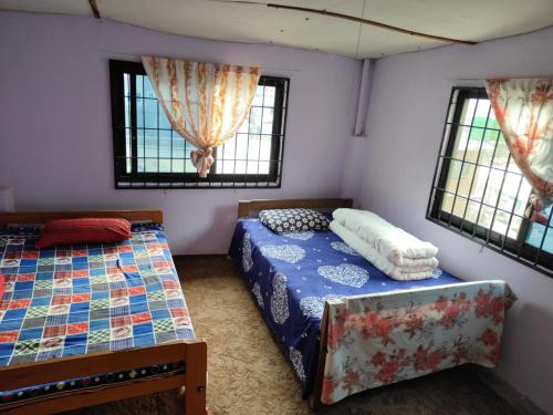 Ένα ή περισσότερα κρεβάτια σε δωμάτιο στο Manthali Community Homestay No13 Aakase