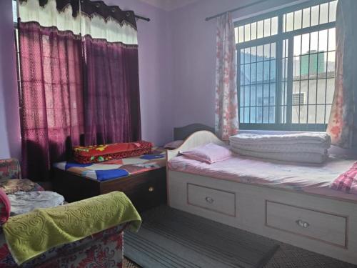 Ένα ή περισσότερα κρεβάτια σε δωμάτιο στο Manthali Community Homestay No13 Aakase