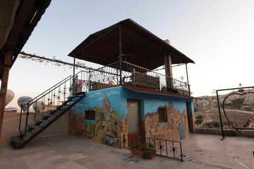 a building with a mural on the side of it at Rose Valley Hotel in Goreme
