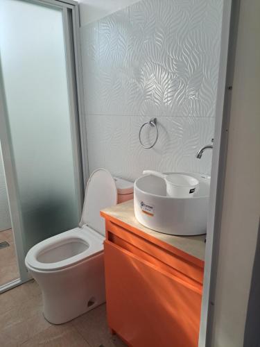 a bathroom with a toilet and a sink at Estefania Homestay in Santa Monica