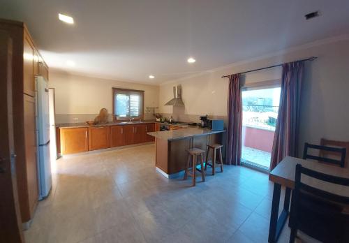 a kitchen with a island and a counter top at Casa da Oliveira in Mondim de Basto