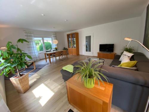 a living room with a couch and a table at Gästehaus Natur in Vöhl