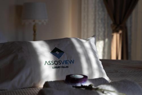 a pillow on a bed with aessenoren insignia on it at AssosView in Asos