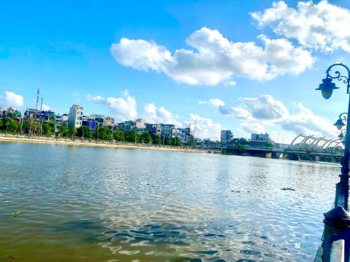 a view of a river with a city in the background at HPT Home II Hoàng Huy Riverside Apartment - Homestay chuỗi căn hộ Hải Phòng in Hai Phong