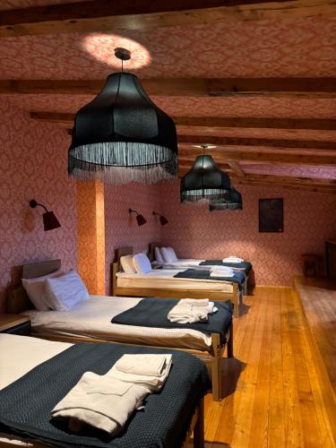 Postel nebo postele na pokoji v ubytování Hotel Memoire Kutaisi