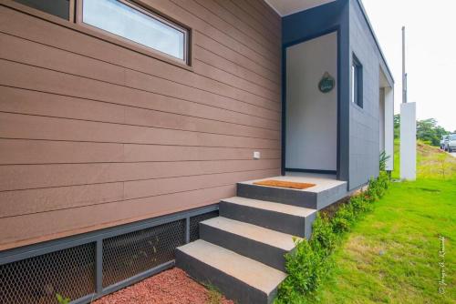 a house with stairs leading up to a door at Casa para Vacacionar Increible en Bejuco in Loma
