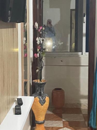 a vase sitting on a table in a room at Vu sur corniche in Safi