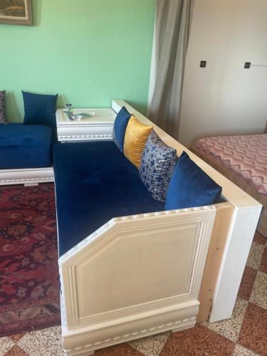 a room with two beds with pillows on them at Vu sur corniche in Safi