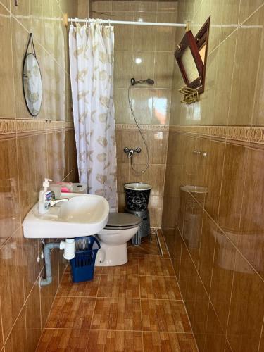 a bathroom with a sink and a toilet and a shower at Vu sur corniche in Safi