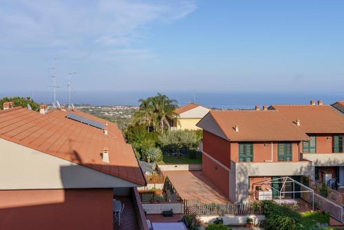an aerial view of roofs of houses at Little Rose garden in Aci Catena