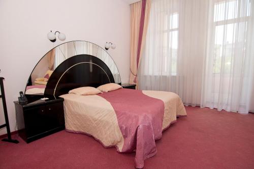 Кровать или кровати в номере Гостиница Астория