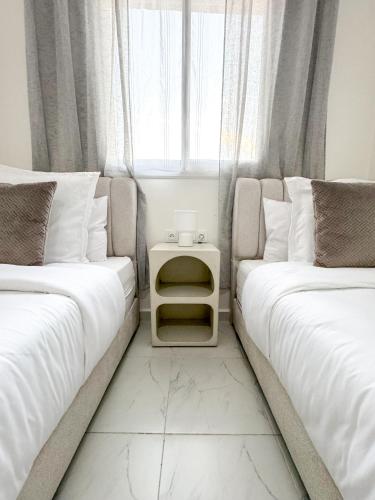 Postel nebo postele na pokoji v ubytování Lyana Home
