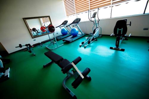 a gym with several exercise equipment on the floor at Graaf Hotel in Baku